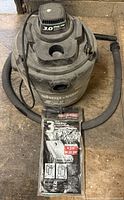 Overall view of Shop-Vac with hose and filter bag package