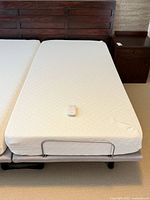 Top view of mattress on adjustable base with remote