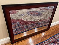 Front view of mirror showing entire wood frame and glass