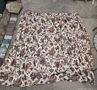 Curtain panel spread out showing full size and pleated top