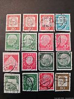 Front view of 16 German stamps arranged 4 × 4 showing denominations and cancellations