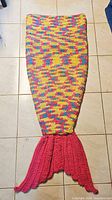 Full view of mermaid tail blanket laid flat