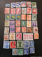 Full layout of 45 international stamps on black background