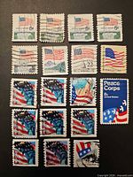 Front view of all 18 cancelled U.S. postage stamps laid out in rows