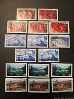 All sixteen Scenic America stamps displayed on dark background