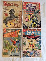Group shot of the four comics showing full covers