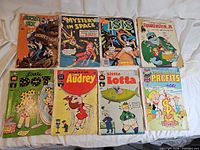 Group shot of all eight comics laid out