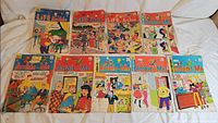 All nine comics laid out in two rows