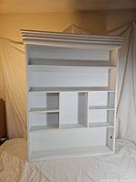 Front view showing shelves, cubbies and crown molding