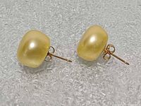 Side view of both earrings showing pearls, posts and butterfly backs