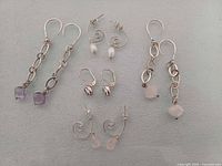 Front view of all five earring pairs laid flat