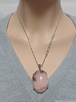 Necklace front view on mannequin showing entire pendant and chain