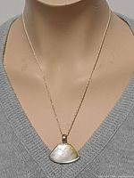 Pendant necklace displayed on mannequin, full view of length and pendant size