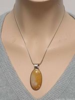 Necklace on mannequin, frontal view