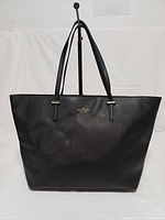 Front view showing logo, shape and handles