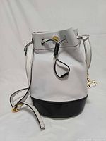 Front view showing drawstring closure, color blocking