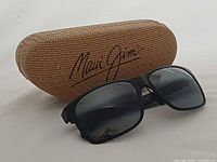 Sunglasses with woven hard case