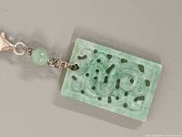 Front view rectangular jadeite pendant with bead and clasp detail