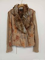 Front view showing faux fur collar, knit sleeves, floral body