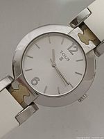 Front view showing dial, case and strap details