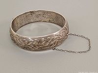 Etched floral exterior view with safety chain visible