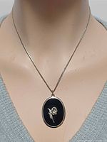 Full view of necklace on mannequin showing pendant and chain length