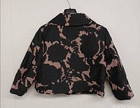 Back view of jacket showing full floral pattern and cropped cut