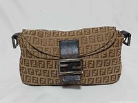 Front view showing FF monogram, leather flap, metal logo clasp