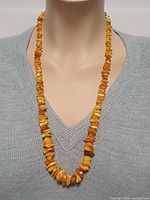 Necklace on mannequin torso showing overall length and bead style