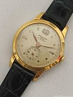 Front view of Reynolds wristwatch showing dial, hands, sub-seconds and case condition