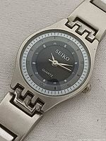 Front view of Seiko ladies quartz watch showing dial and bracelet detail
