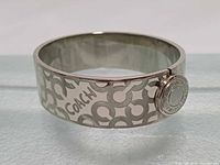 Full view of bracelet showing CC pattern and clasp