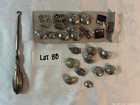Overall lot: button hook, bagged and loose nursing buttons, badges, patches