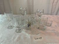 Front and side view of assorted glasses on table