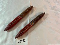 Top view of both painted wooden clap sticks