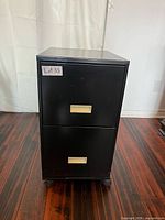 Front view showing two drawers with silver pulls and lot label