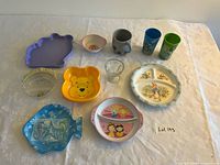Group overview of all ten children’s dinnerware items on table