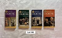 Front covers of all four volumes