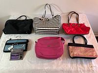 Group shot showing all six purses and jewellery bag