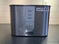 Front view showing DeLonghi branding, control panel, brushed stainless body