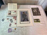 All items laid out: lithograph, booklet, presentation folder, FDCs, stamp block