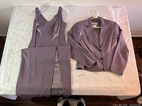 Dress and blazer laid flat on table