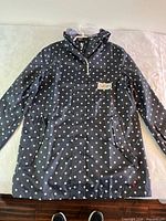 Full view of front of Joules polka dot rain coat