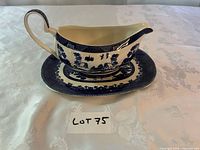 Gravy boat on underplate front view