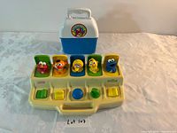 Playskool pop-up number toy with carrying case behind