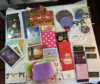 Overview of greeting cards, gift bags, ribbons, mats and tissue packs