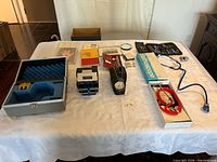 Overall view of medical instruments, books and cases on table