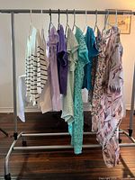 Full view of clothing rack showing all garments