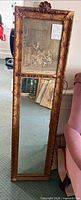 Full front view showing entire mirror with tapestry upper and mirror lower