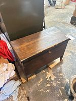 hope chest closed, showing front, lock hasp, wear